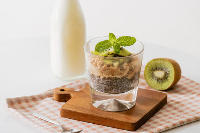 Healthy breakfast with yogurt, nut, kiwi and chia seeds. Bowl of fresh fruit. Healthy breakfast with yogurt, nut, kiwi and chia seeds. Bowl of fresh fruit.