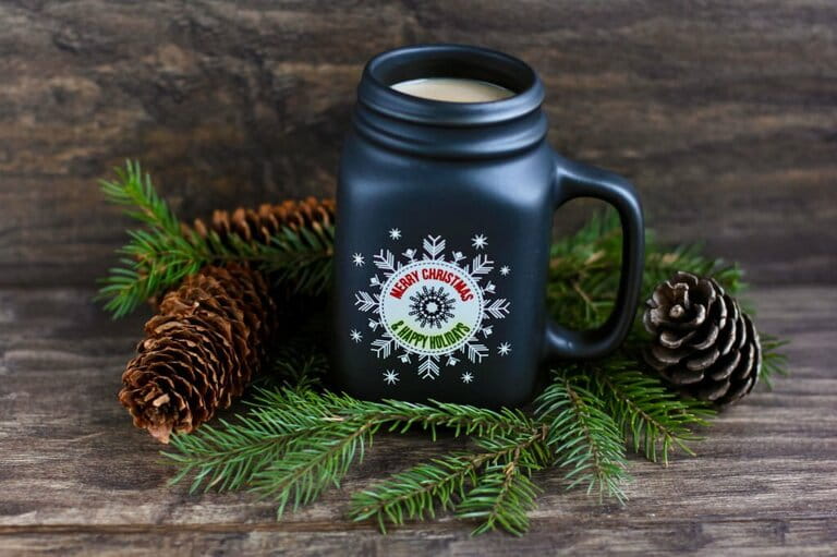 Hot coffee cup with milk, marshmallows and Lollipops on rustic wooden background with christmas decorations and lights. Hot coffee cup with milk, marshmallows and Lollipops on rustic wooden background with christmas decorations and lights.