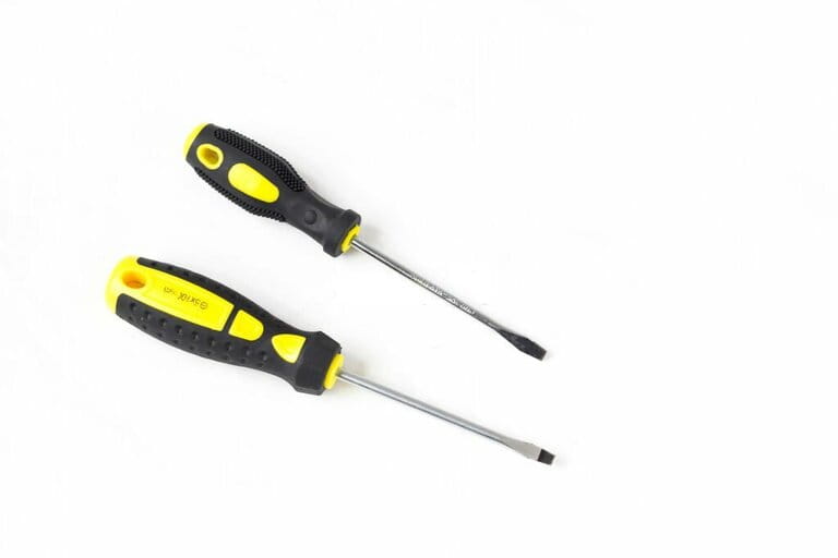 Flat head screwdriver with yellow and black plastic handle Flat head screwdriver with yellow and black plastic handle