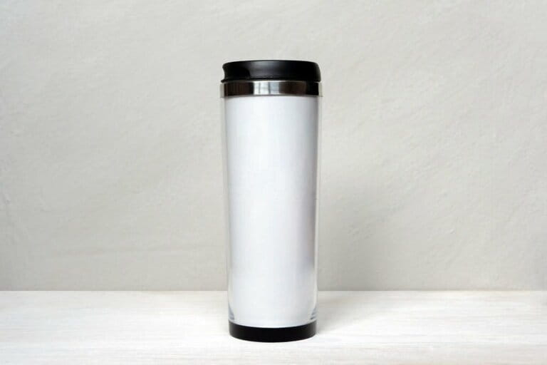 White thermal tumbler mockup on white gray background. Cup for design